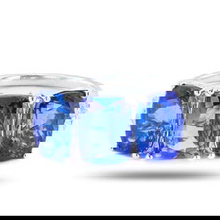 6.55ctw Tanzanite and 0.35ctw Diamond Platinum Ring: Platinum (PLAT) natural tanzanite zoisite and diamond ring. Three (3) rectangular cushion brilliant cut natural tanzanite zoisite gemstones are mounted in the center of the ring. Round brilliant cut d