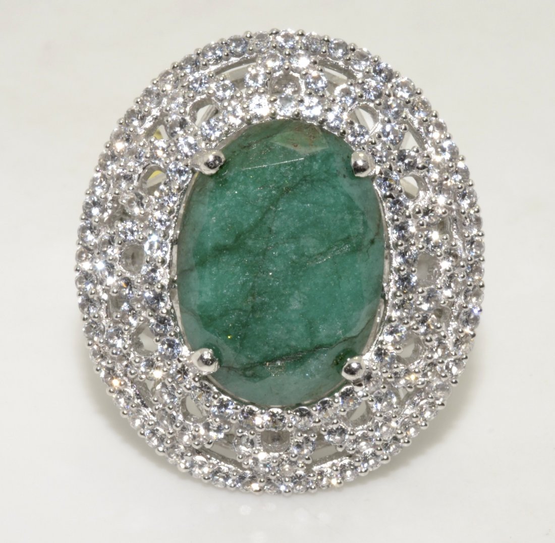 Emerald & Sapphire Ring Appraised Value: $10,138: Platinum plated over silver ring with 2.58 ct of colorless sapphires and 11.60 ct enhanced emerald/beryl (CENTER STONE) K44J7