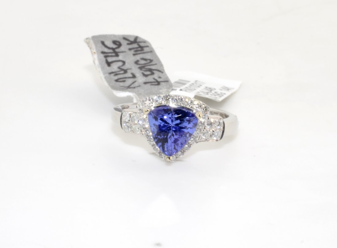 Tanzanite & Diamond Ring AV: $8,978: 14K white gold ring with a 1.84 ct violet blue tanzanite center stone and 0.34 cts of diamonds (I1, F Color) K24J46