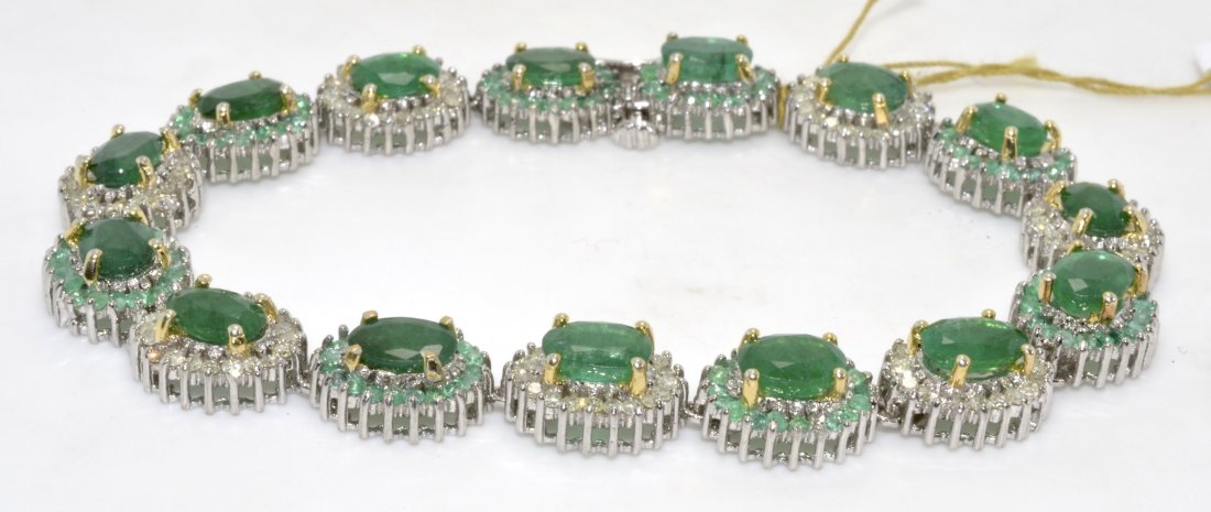 Emerald & Diamond Bracelet Appraised Value: $17,586: Silver bracelet and 18K yellow gold prongs with 1.45 ct of diamonds and 14.20 ct genuine emeralds/beryls K23E66