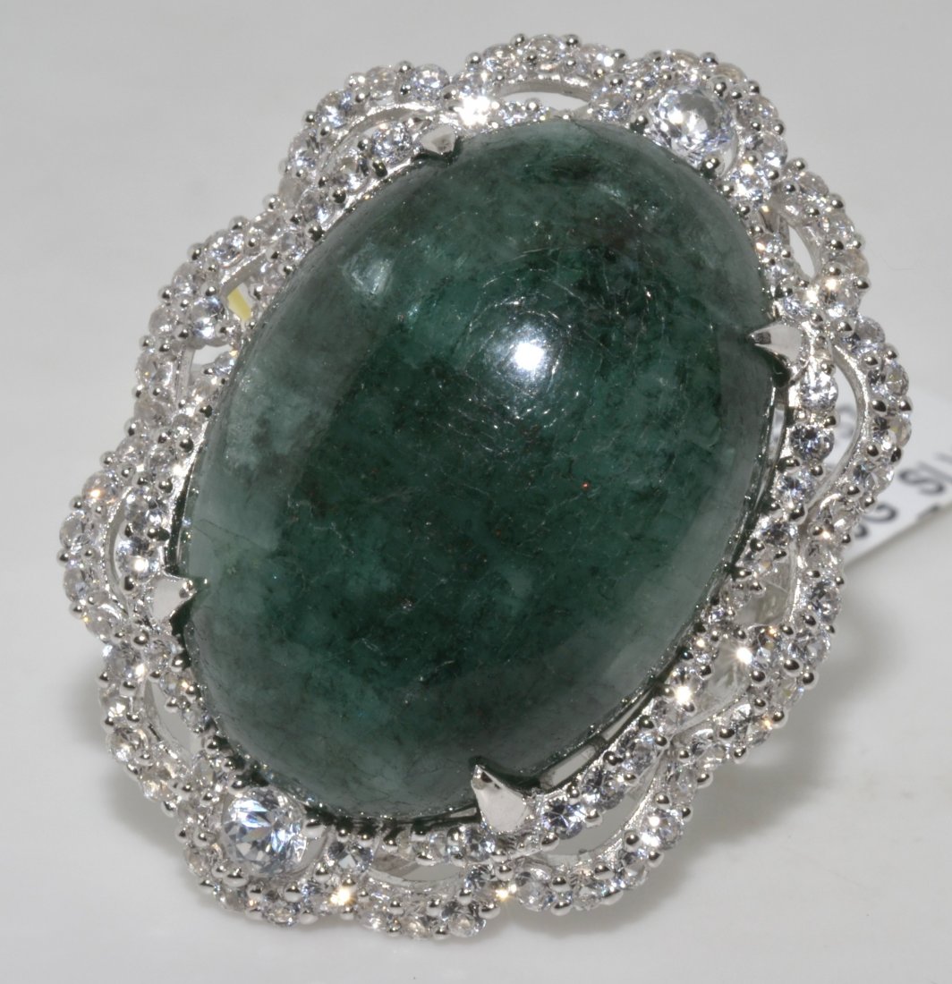 Emerald & Sapphire Ring Appraised Value: $9,312: Platinum plated over silver ring with 2.04 ct of colorless sapphires and 28.50 ct enhanced emerald/beryl (CENTER STONE) K35J2