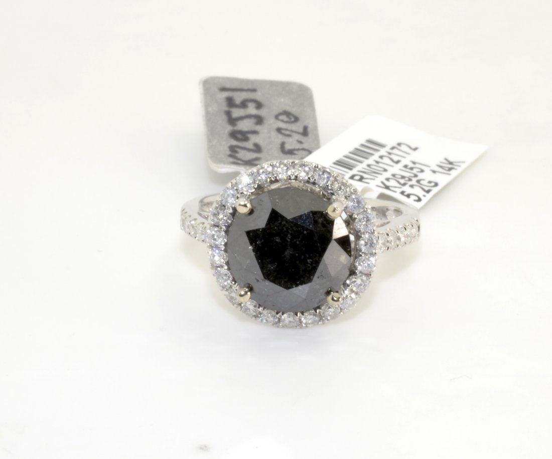 Black & White Diamond Ring AV: $5,325: 14K white gold ring with a 4.75 ct black diamond center stone and 0.60 cts of white diamonds (I1-I2, G-I Color) K29J51