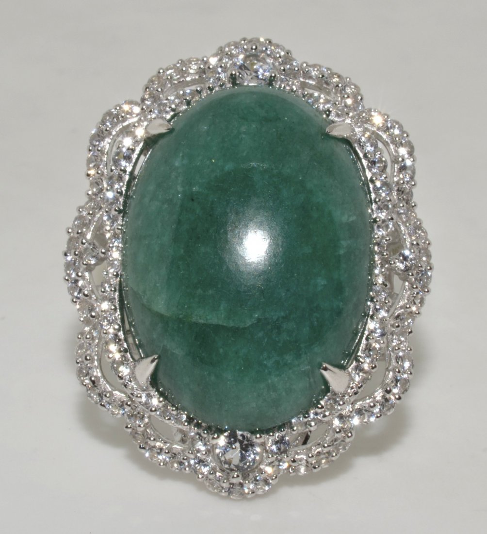 Emerald & Sapphire Ring Appraised Value: $9,159: Platinum plated over silver ring with 2.04 ct of colorless sapphires and 28.46 ct enhanced emerald/BERYL (CENTER STONE) K35J9