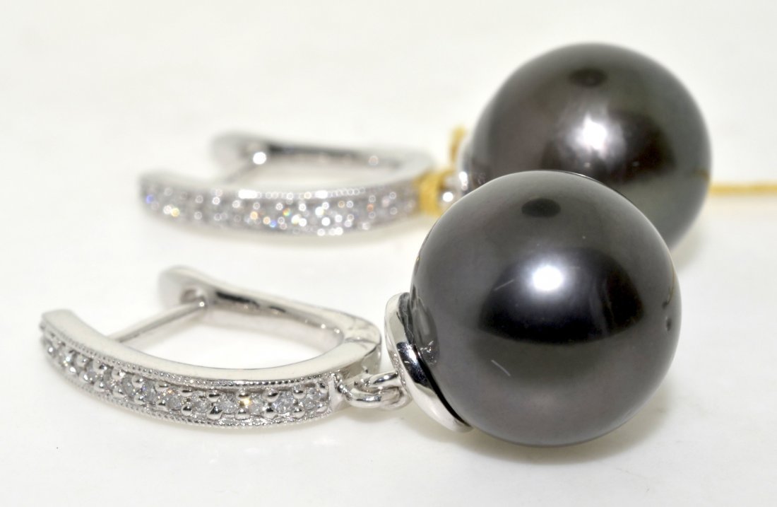 Tahitian Pearl & Diamond Earrings AV: $4,215: 14K white gold earrings with 0.14 ct of diamonds and 2 black tahitian cultured pearls 12.0mm in size K13J11