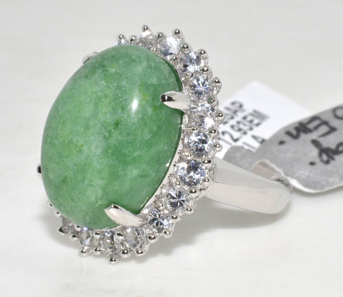 Emerald & Sapphire Ring Appraised Value: $2,678: Platinum plated over silver ring with 1.72 ct of colorless sapphires and 12.93 ct enhanced emerald/beryl center stone K14J9