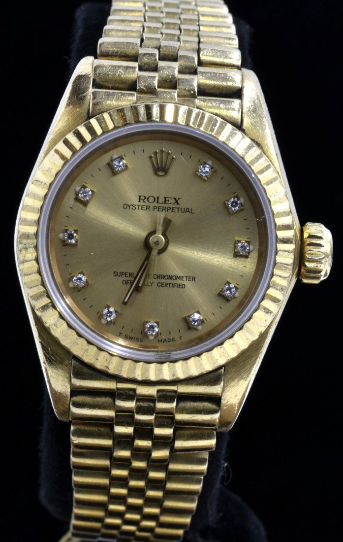 Rolex 18K Gold Oyster Perpetual Watch AV: $12,100: Ladies 18K gold Rolex Oyster Perpetual wristwatch K16J113