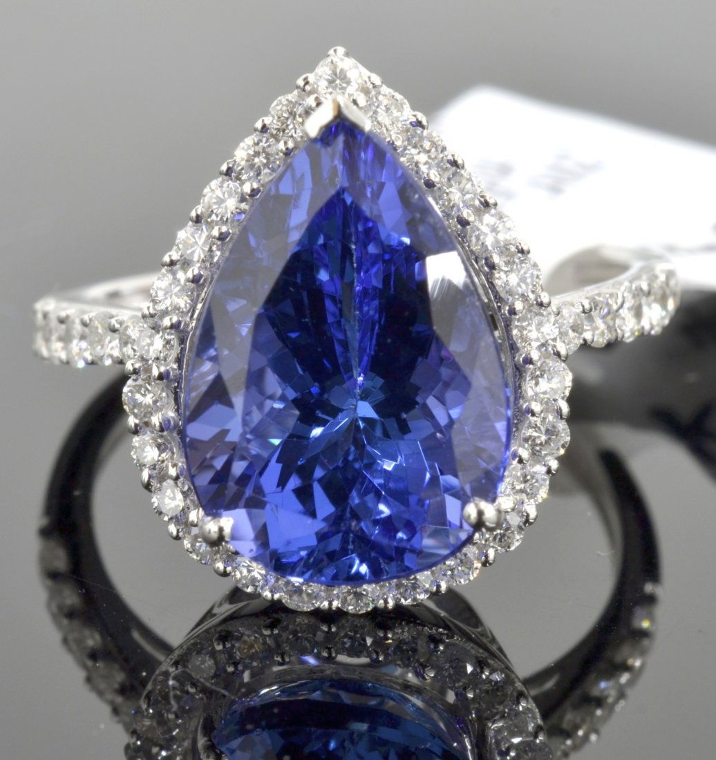 Tanzanite & Diamond Ring Appraised Value: $16,100: 14K white gold ladies cast tanzanite and diamond ring with 36 = 0.59 ct prong set diamonds and a centered 5.31 ct pear mixed cut natural tanzanite K53J61