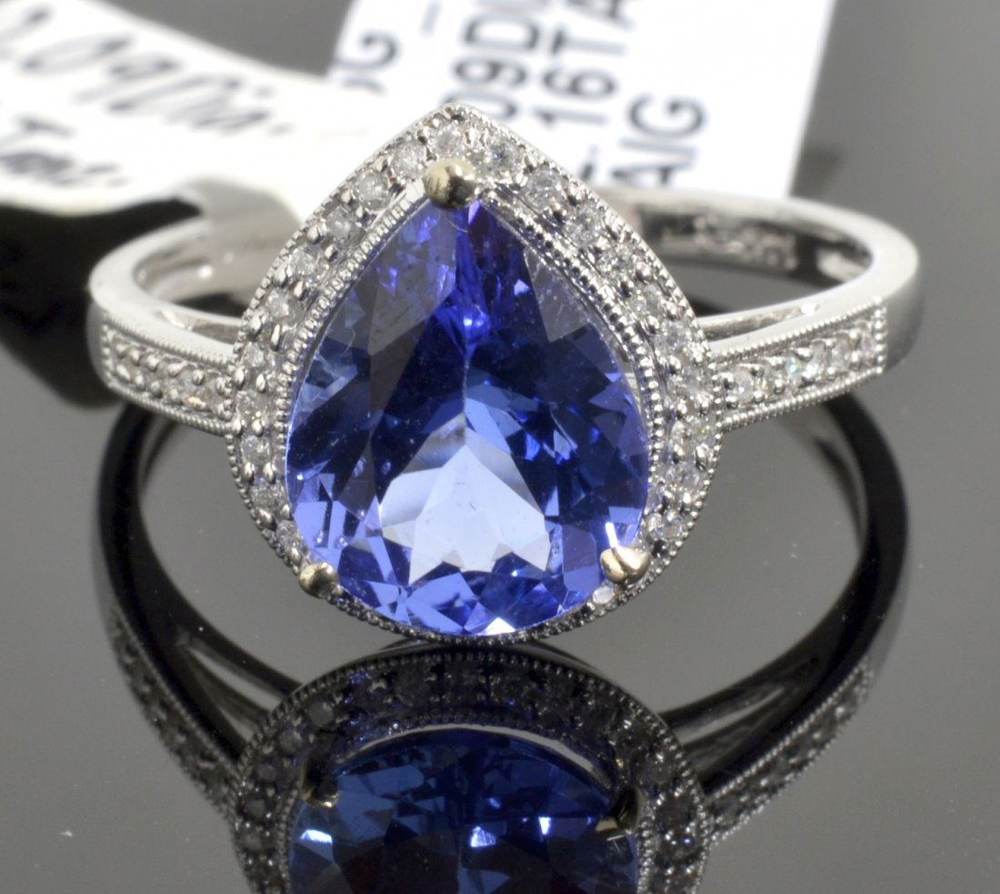 Tanzanite & Diamond Ring Appraised Value: $5,665: 14K white gold ladies cast tanzanite and diamond ring with 0.09 ct of diamonds and a centered 2.16 ct natural tanzanite K16J16