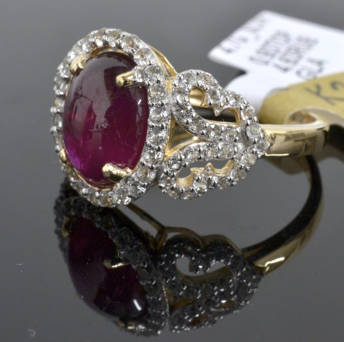 Ruby & Topaz Ring Appraised Value: $5,340: Platinum plated/silver ring with 0.93 ct of colorless topazs and 4.63 ct ruby center stone K25J7