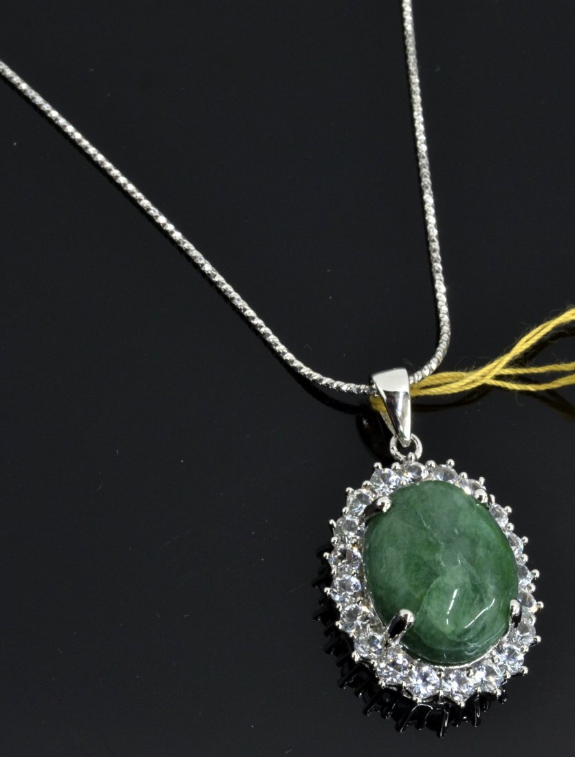 Emerald & Sapphire Necklace AV: $4,271: Platinum plated over silver necklace with 2.22 ct of colorless sapphires and 12.27 ct enhanced emerald/beryl center stone K15J7