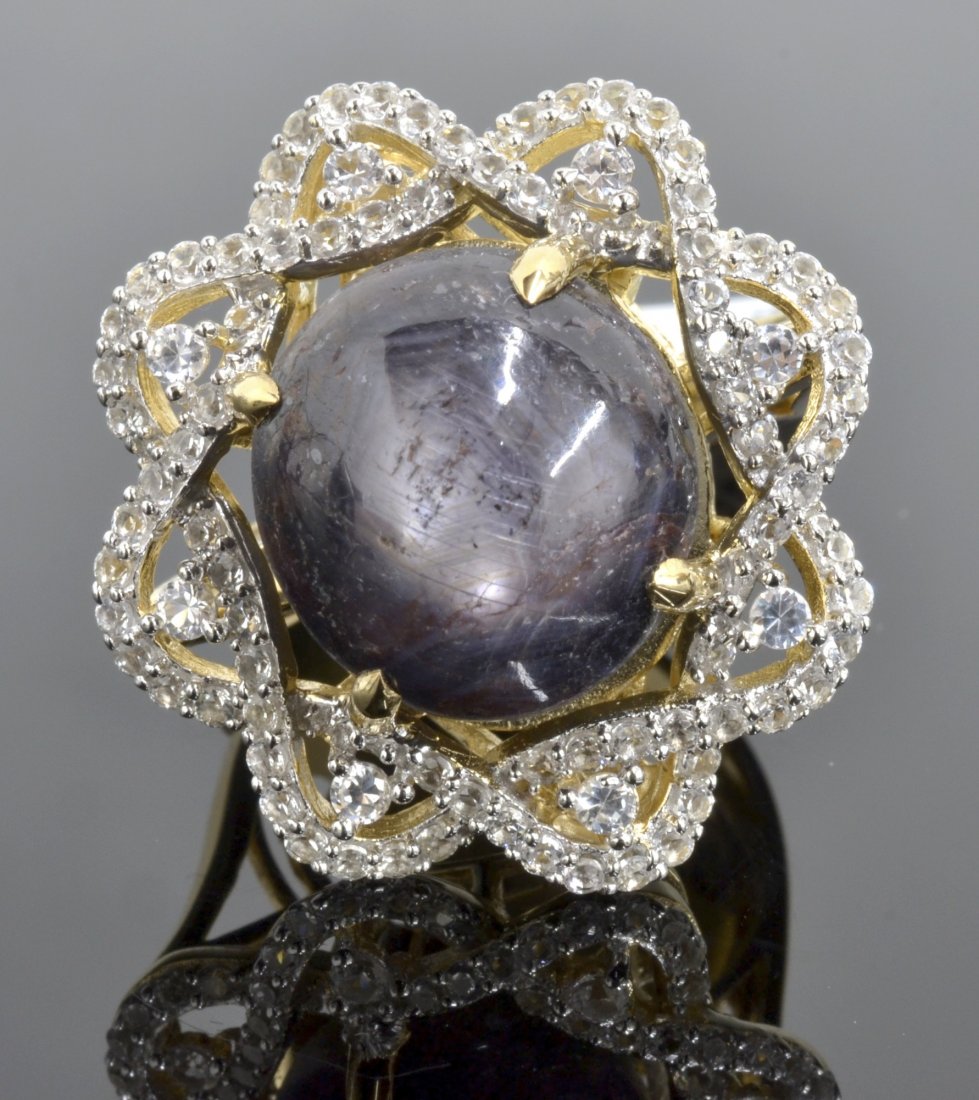 Star Ruby & White Sapphire Ring AV: $2,900: 925 silver ladies cast star ruby and white sapphire ring with 1.54 ct of oval cut natural white sapphires and a centered 22.31 ct natural star ruby K33J3