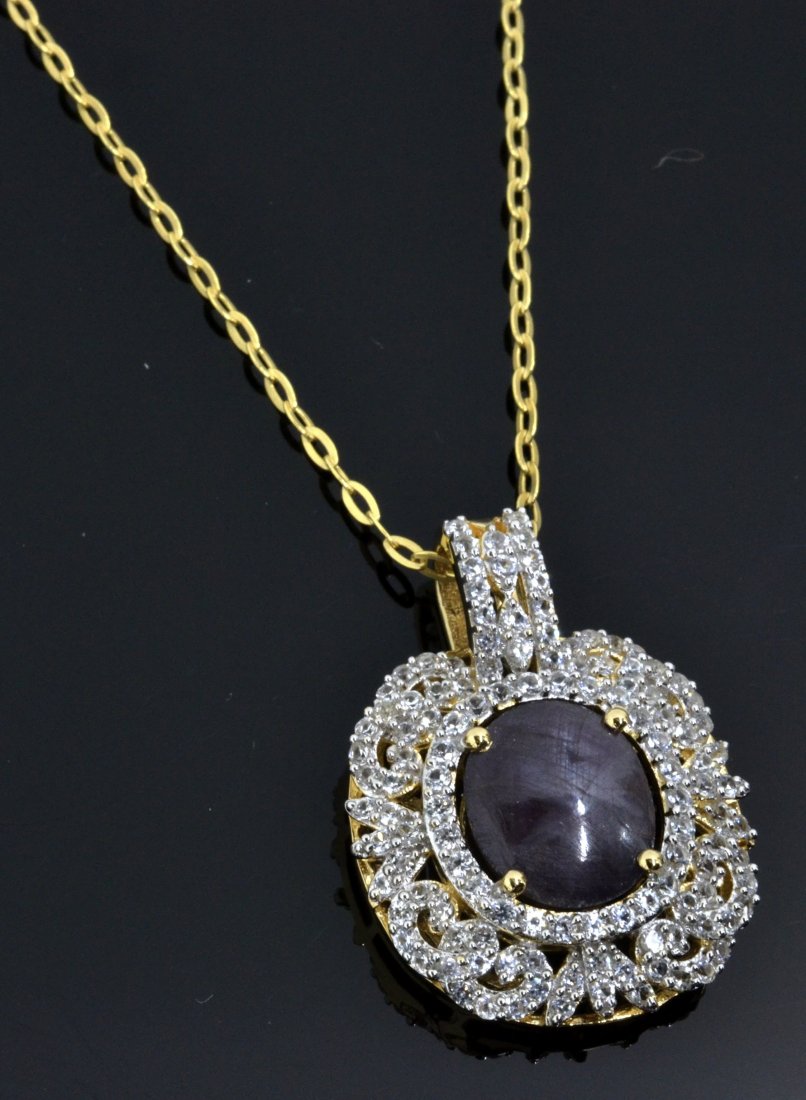Ruby & Sapphire Necklace Appraised Value: $5,003: Yellow and white gold plated silver with 1.78 ct of colorless sapphires and 10.23 ct genuine ruby center stone K31J1
