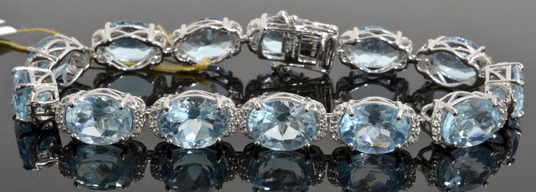 Topaz Bracelet Appraised Value: $4,101: Platinum plated/silver bracelet with 1.23 ct of colorless topazs and 40.84 ct of blue topazs K63J4