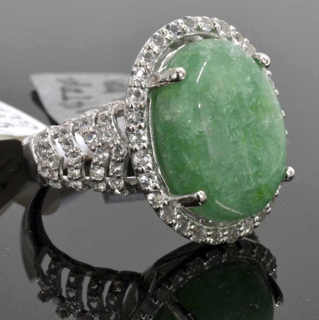 Beryl & Topaz Ring Appraised Value: $4,160: Platinum plated/silver ring with 0.84 ct of colorless topazs and 7.83 ct emerald/beryl center stone K20J8