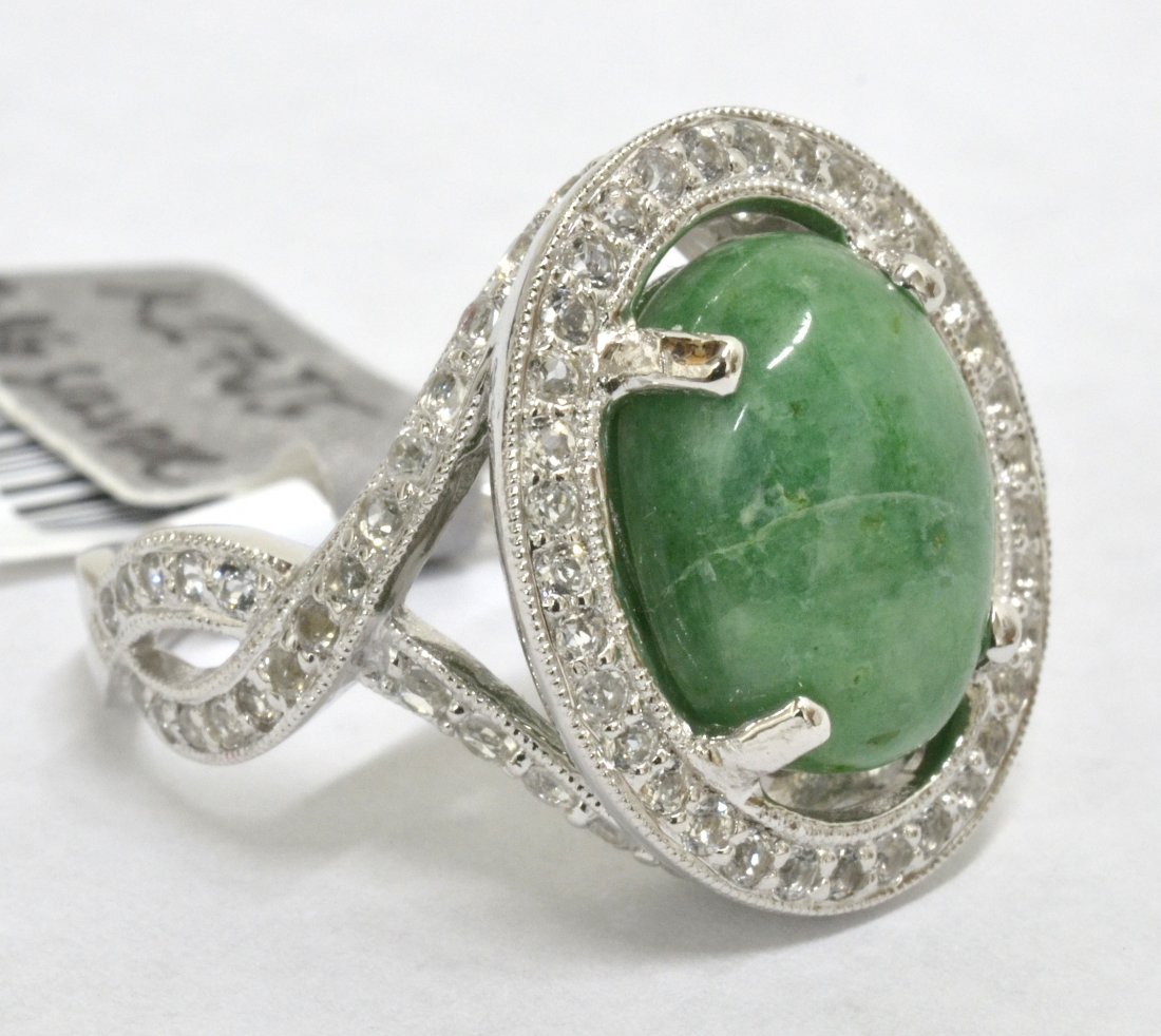 Beryl & Topaz Ring Appraised Value: $5,500: Platinum plated/silver ring with 1.46 ct of colorless topazs and 6.63 ct emerald/beryl center stone K27J5