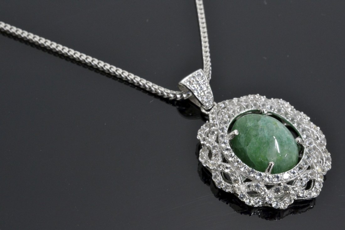 Emerald & Topaz Necklace Appraised Value: $3,336: Platinum plated/silver necklace with 1.96 ct of colorless topazs and 9.00 ct emerald/beryl center stone K41J7