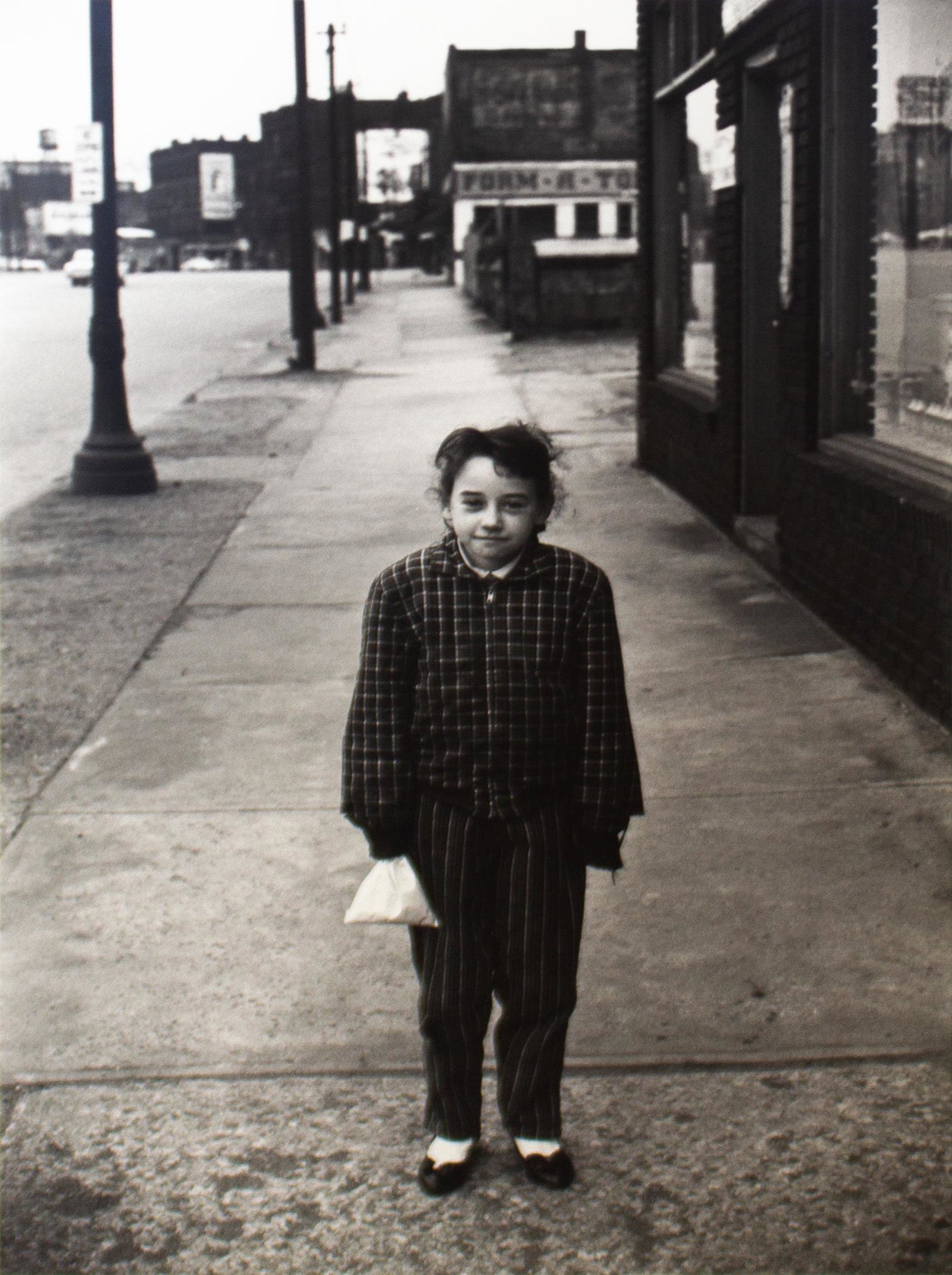Lee Friedlander (1934) Cleveland, (Girl with Handkerchief) , 1961: Gelatin Silver Print Signed on verso Provenance: Fraenkel Gallery Image: 12 7/8 x 8 5/8 inches Framed: 19 7/8 x 15 3/8 inches