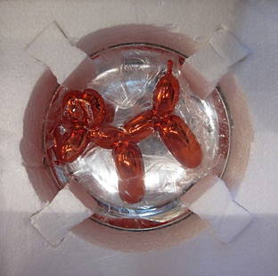 Jeff Koons, Red Balloon Dog, 1995: Porcelain with reflective metallic finish in original boxrnNumbered 707/2,300
Published by: The Museum of Contemporary Art, Los Angeles, CArnCondition: Mint, never been out of box rnSize: 10.25
