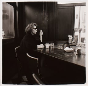 Diane Arbus: Woman at a counter smoking, N.Y.C., 1962; printed 1962