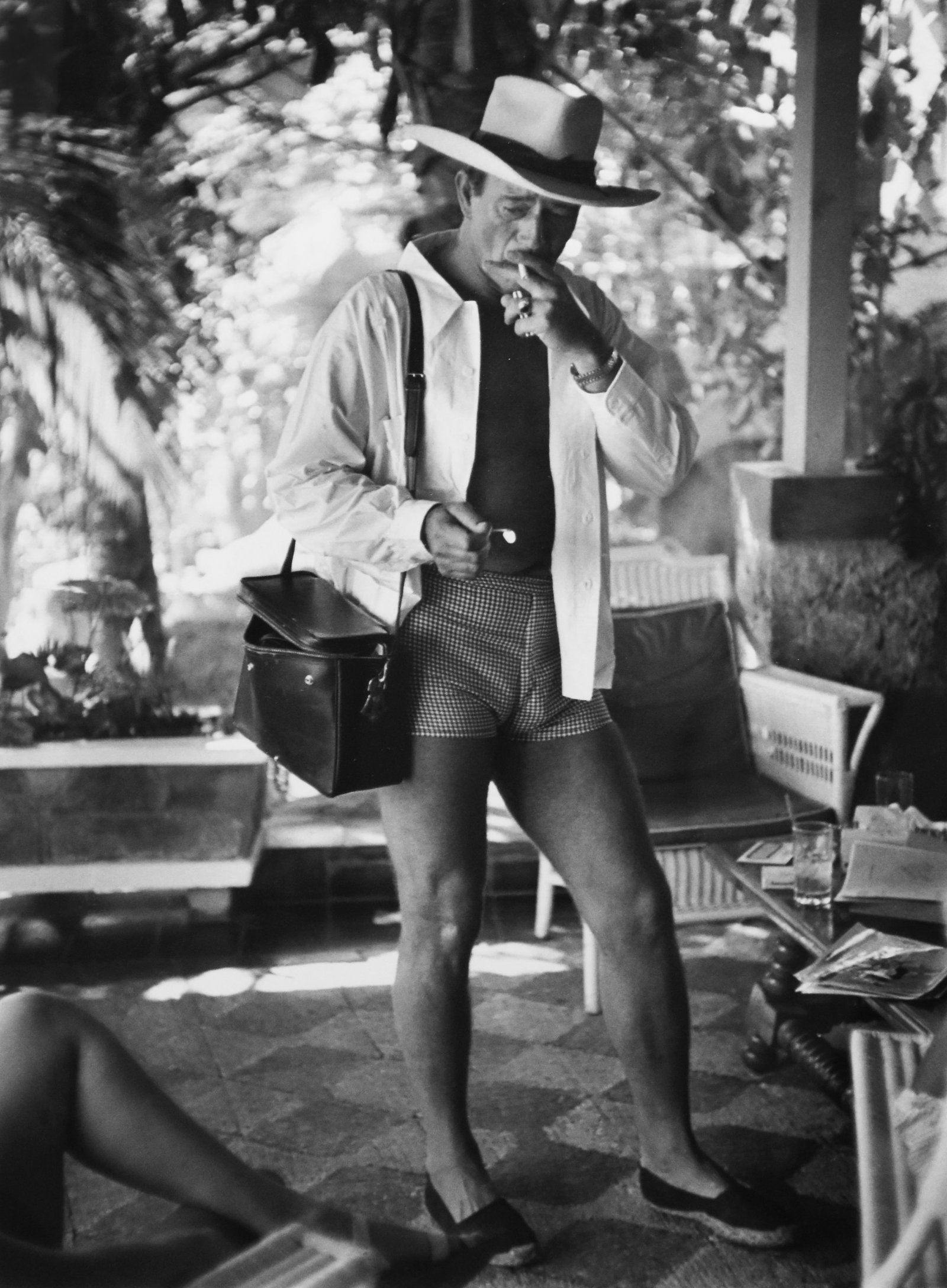 Phil Stern (1919-2014): John Wayne in Patio of his Hotel in Acapulco, Mexico, printed 1970: Phil Stern (1919-2014) John Wayne in Patio of his Hotel in Acapulco, Mexico, printed 1970 Gelatin silver print Signed, titled and dated on verso in pencil by the artist Artist’s stamp on verso Prove