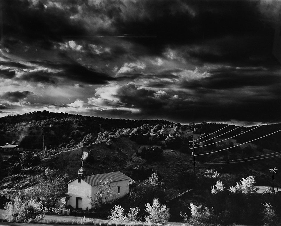 Craig Varjabedian Lot of Two Capilla de Nuestra Sentra: Capilla de Nuestra Sentra de la Luz Sunset and Evening Storm, Canoncito at Apache Canyon, New Mexico, 1985/1999 Gelatin silver print, mounted From the numbered edition of 200 Signed and numbered in pe