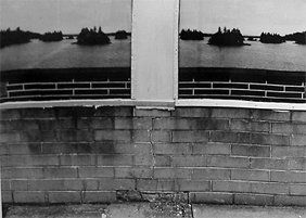 Lee Friedlander Untitled (Brick wall with body of w: Lee Friedlander Untitled (Brick wall with body of water) 1969Vintage gelatin silver print on heavy paper mountSigned in pencil recto, the number "4" in pencil on verso of mountPrinted by Lee Friedland