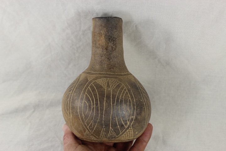 Beautiful Engraved Caddo Pottery Water bottle: Beautiful Engraved Caddo Pottery Water bottle. measurements approximately: 6 1/2" tall 4 1/2" wide