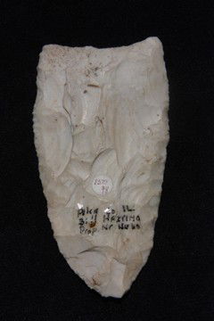 Paleo Lanceolate: Paleo Lanceolate made from whitish Burlington chert. Broad flake scares across the face, polished slightly from use and age. A very typical look of very ancient chert of this type. Sometimes describ