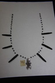 Rare Obsidian pendant with Beads: Rare Obsidian pendantin the effigy of a man with Beads also of obsidian. The pendant is made from one large flake of obsidian. One of the most accomplished works of lithic art known. The skill and tec