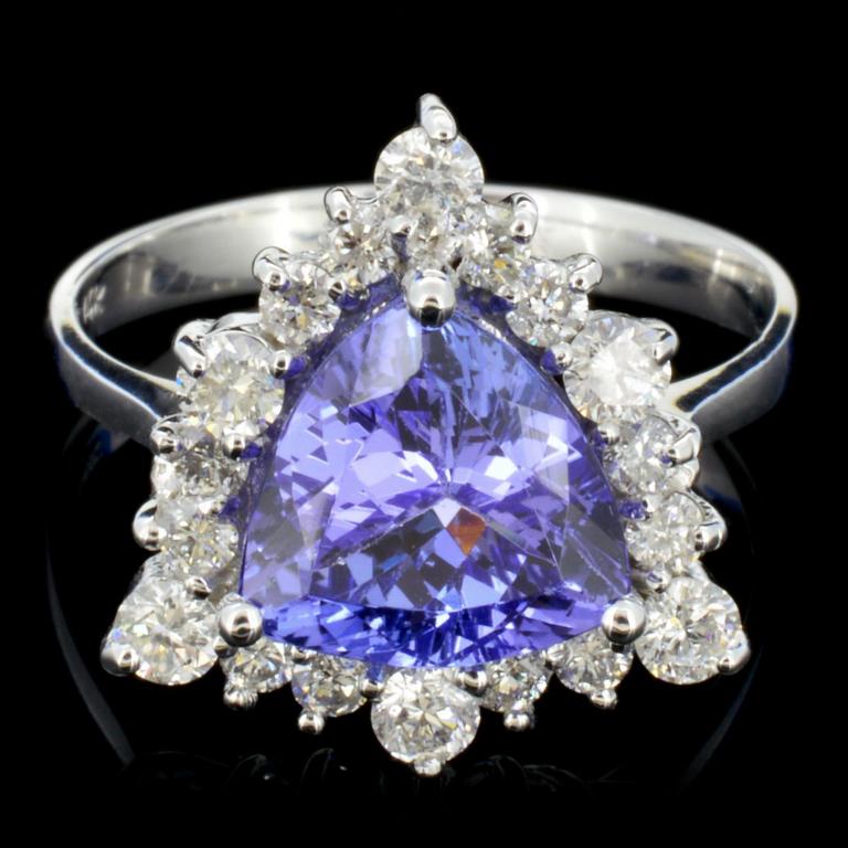 14K Gold 3.50ct Tanzanite & 1.00ctw Diamond Ring: Estimated Retail Replacement Value: $10,500.00 Ref: WAG6000 Item no.: ARA101316029 Specification: Gold Content: Solid 14K White Gold Weight of Item: 5.0 grams Size: 6.75 Country Made: U.S.A Main Gemst