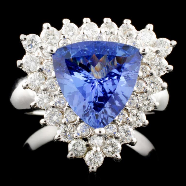 14K Gold 2.45ct Tanzanite & 2.45ctw Diamond Ring: Estimated Retail Replacement Value: $13,528.00 Ref: WAG7730 Item no.: LAI4017-SR47 Specification: Gold Content: Solid 14K White Gold Weight of Item: 8.03 grams Country Made: U.S.A. Ring Size: 7.5 Main