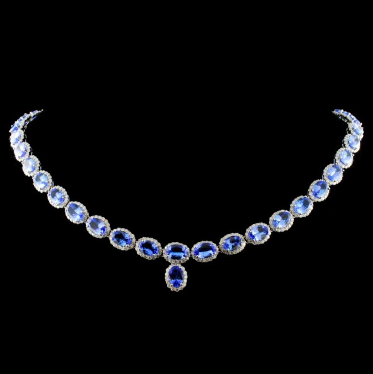 14K Gold 31.59ct Tanzanite & 6.50ctw Diamond Neckl: Estimated Retail Replacement Value: $37,800.00 Ref: WAG15120 Item no.: FA2052891015-N422ATZ6 Gold Content: 14K White Gold Weight of Item: 25.50 grams Size: N/A Main Gemstone: Tanzanite Shape: Oval cut