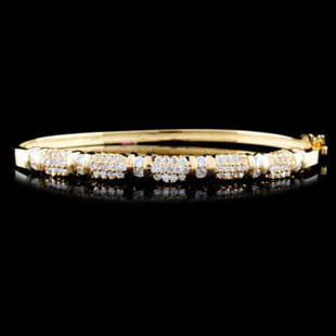 14K Gold 1.31ctw Diamond Bracelet: Estimated Retail Replacement Value: $9,240.00Ref: WAG5280Item no.: EJJ036Specification:Gold Content: Solid 14K Yellow GoldWeight of Item: 12.1 gramsCountry Made: U.S.AMain Gemstone: Natural