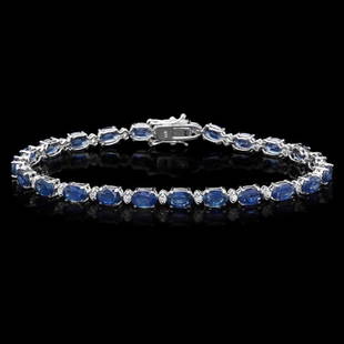 `14k Gold 12.00ct Sapphire & 0.50ct Diamond Bracel: Estimated Retail Replacement Value: $9,200.00 Ref: WAG5800Item No.: ARA-CRA071Metal: 14k Solid White GoldSize: 7.5Total Item Weight: 9.00 gramsCountry Made: USAMain Stone: SapphireColor: BlueCarat
