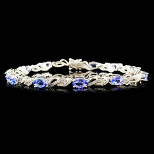 14K Gold 4.52ct Tanzanite & 0.32ctw Diamond Bracel: Estimated Retail Replacement Value: $4,998.00Ref: WAG4856Item no.: FA2057323027-MB2923ATZSpecification:Gold Content: Solid 14K White GoldWeight of Item: 8.00 gramsSize: 7 inchesCountry Made: