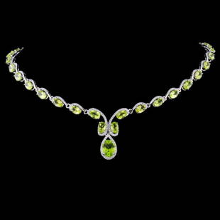14K Gold 21.61ctw Peridot & 2.20ctw Diamond Neckla: Estimated Retail Replacement Value: $20,350.00Ref: WAG8140Item no.: FA2054658030-N2006APDTSpecification:Gold Content: 14K White GoldWeight of Item: 23.7 gramsCountry Made: U.S.A.Main Gemstone: