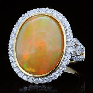 18K Gold 7.87ct Opal & 1.02ct Diamond Ring: Estimated Retail Replacement Value: $17,400.00Ref: WAG6960Gold Content: 18K Yellow GoldWeight of Item: 9.6 gramsMain Gemstone: Natural Opal Shape: OvalWeight: