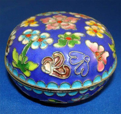 Round Blue Enamel Silver Box With Flowers Eggshell Blue: This beautiful enameled silver box features multicolored flowers engraved and enameled on the top and around the bottom of the box. The interior is eggshell powder blue, as well as the bottom. Dimensi