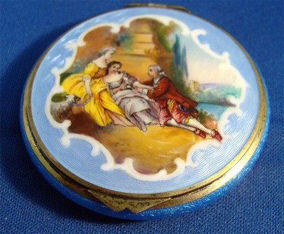 Guilloche Enamel Compact Man With Two Women (two Piece): This is stamped with a hallmark. Hinge is broken and there is a small flaw in the reverse. Dimensions 2" in diameter Weight 50grams