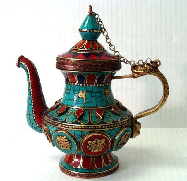 Nepalese Buddhist Decorated Ceremonial Teapot: Traditional nepalese design, handcrafted with silver, turquoise and coral inlays. Dims 7. 5" tall by 7" by 4"
