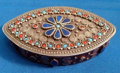 Oval Enamel Silver Box Turquoise And Coral Accent: This silver box is deeply engraved and decorated with carnelian, turquoise and coral enamel accents and beads. The decoration continues around the sides of the bottom, dimensions 3"x2"x. 5"tall, weigh