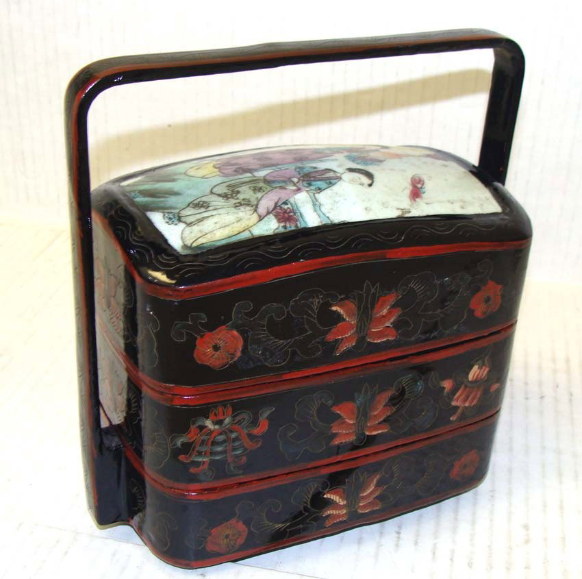 Chinese Porcelain & Wood Three Tier Jewelry Box: Three separate compartments fit together, the top one is hand-decorated porcelain scene of Two Ladies in Kimonos, dimensions 8.5" tall by 8" by 4". Red and Black lacquer decorations on sides and handl
