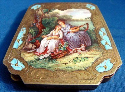 Enamel Silver Compact Lady Playing Guitar With Dog: Nice enamel painting of a woman reading a book next to another woman playing guitar, seated near a tree with a dog at their feet. The painting is framed with engraved silver and turquoise enamel accen