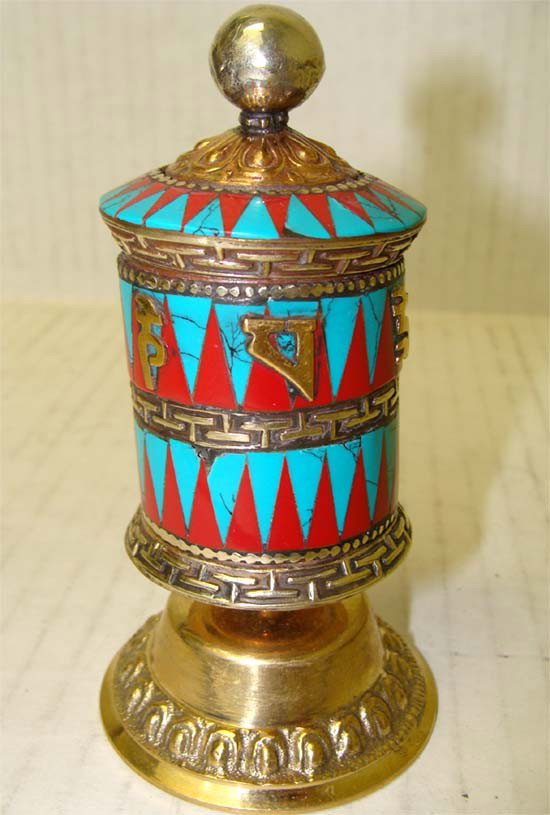 Nepalese Buddhist Ceremonial Prayer Wheel Silver Coral: Intricate handcraft with turquoise, silver and coral, a prayer wheel is a holy object containing the tibetan mantra "om! Mane padme hum! " ("hail! Jewel in the lotus! ") written many times on a scroll