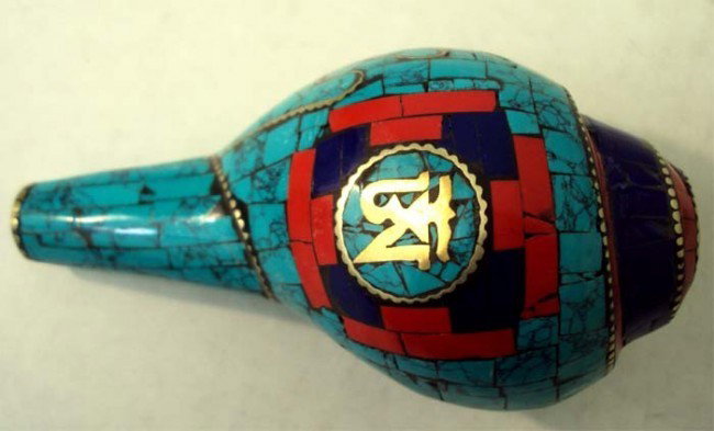 Nepalese Ritual Conch Shell Inlaid Turquoise Lapis silv: This unusual and wonderful Ritual Conch Shell is beautifully carved with semi precious stones and silver. Dimensions 4.5" by 2.5"