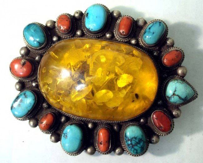 Amber Coral & Turquoise Sterling Silver Nepalese Buckle: Handmade Nepalese Sterling Silver Belt Buckle with 7 Turqoise stones and 7 coral stones surrounding a large oval amber (amber dims 2.5" by 2") Overall dims 4" by 3.5" by 1"