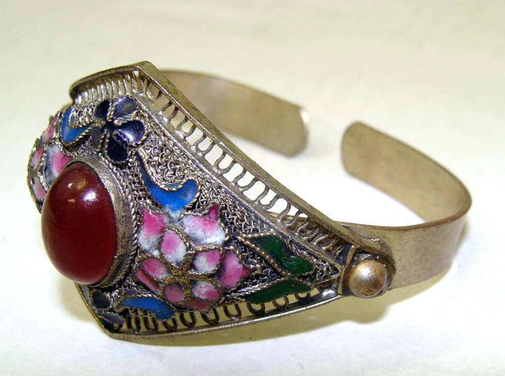 Nepalese Silver Metal Cloissone Enamel Bracelet: Ornate Pink and Blue enamel work circles a large red cabachon stone in the center. Bracelet Width 2.5". K7W4
