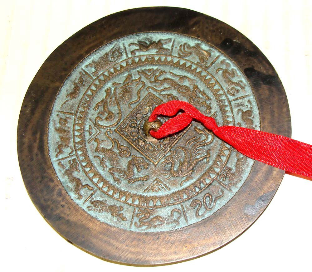 Chinese Bronze "Mirror" 4 1/2" diameter: The front side is intricately engraved, the reverse is smooth and was used as a mirror, age unknown. K2W73