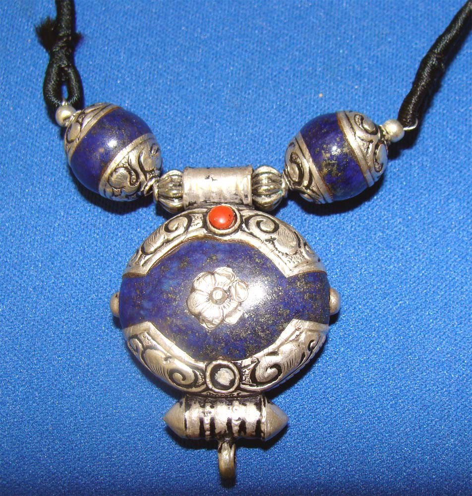 Nepalese Afghan Lapiz Sterling Silver Choker 16": A Coral bead and three lapis stones are mounted in a sterling silver settings to form a necklace. Pendant size 2" by 2", mounted to a 16" cord. made in Nepal. K15W1