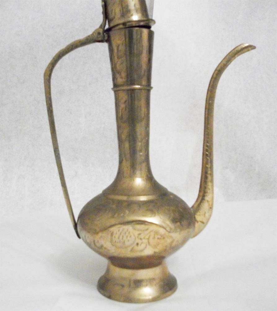 Jordanian Brass Ewer 12.5" Tall: EWER FROM the Al Afganhi Co in Jordan. Solid brass with delicate filigree designs. 12 1/2” long by 7' wide. Weight one pound. K15W1BL